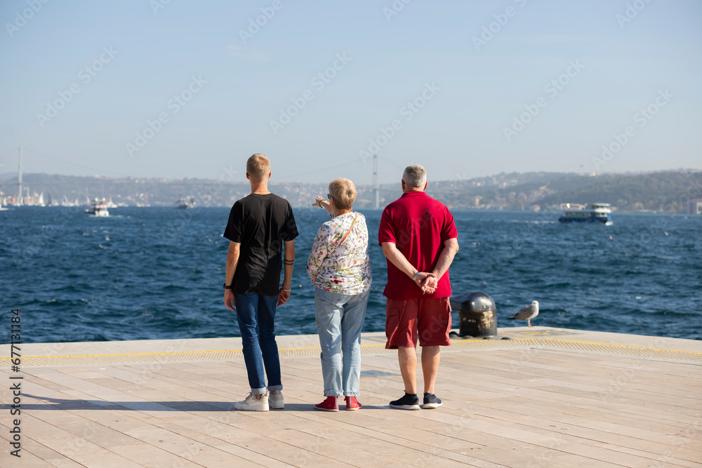 Tourist family watching the sea at Istanbul Galataport Tourist family watching the sea at Istanbul Galataport
