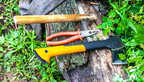 Purchased (consumer goods) Hammer, pliers and axe close-up