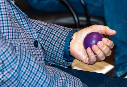 Rubber ball in a man's hand close-up