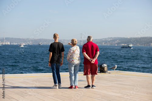 Tourist family watching the sea at Istanbul Galataport