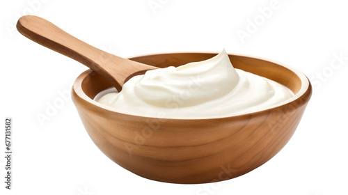 Wooden bowl with sour cream and a wooden spoon, cut out