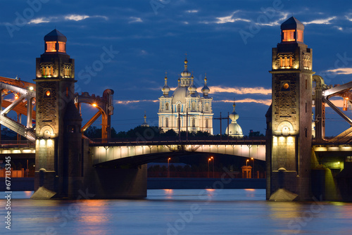 The Peter the Great Bridge against the background of the Smolny Cathedral on a white night. Saint-Petersburg, Russia. photo