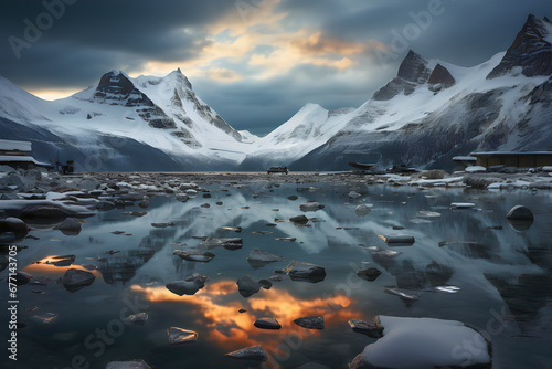 Beautiful winter landscape with snow-capped mountains reflected in water