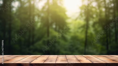 The empty wooden table top with blur background of forest . Exuberant image. soft focus background. copy space. 