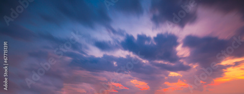 Evening clouds and sky,Purple orange pink sunset. Beautiful evening sky with clouds background for design.
