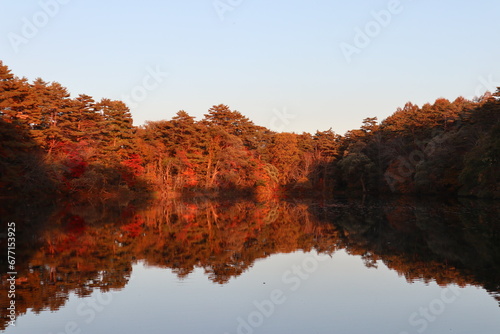 Scenery of Yanaginuma pond and autumn leaves at dusk in Goshikinuma, Urabandai, Fukushima, Japan