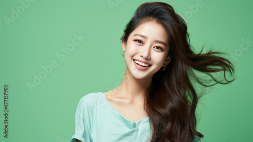 Portrait of vogue fashion smiling Asian girl, soli color background