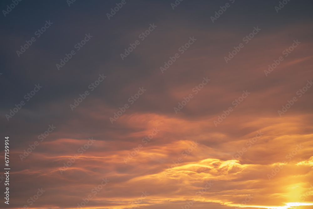 beautiful orange dramatic clouds at sunset