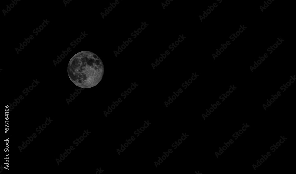 Full moon in the immense darkness of space Full moon in the immense darkness of space