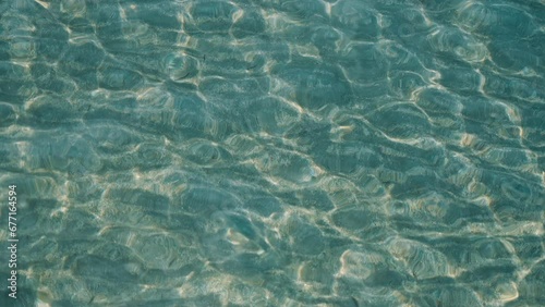 Caustics in transparent water of a lake