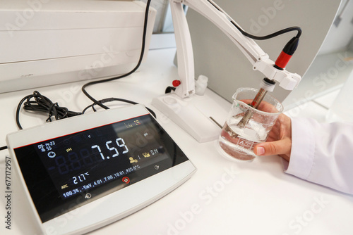 Scientist used chemical solution and lab testing for water quality or ph meter in laboratory ,research and science concept