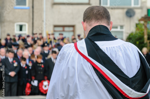 Remembrance Sunday commemoration.  Presbyterian minister leads audience in prayer photo
