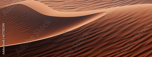 Golden sand dunes with distant cliffs.