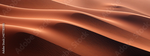 Golden sand dunes with distant cliffs.