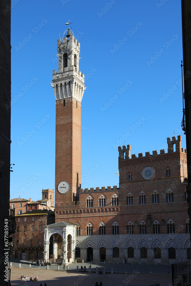 Obraz premium Siena Italy Tower called TORRE DEL MANGIA and the Cappella a marble tabernacle at the foot of the tower