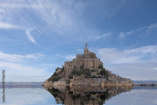 Reflection on the water of abbey of Monte Saint Michel in Northern France