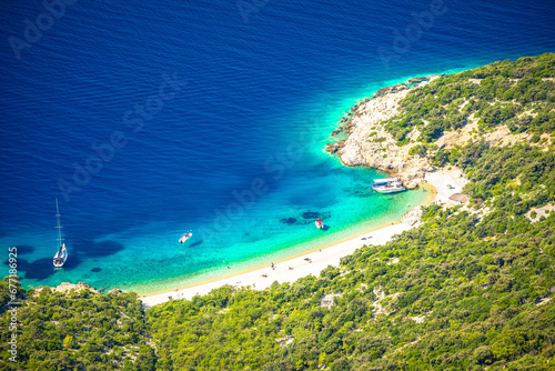Secret turquoise beach below Lubenice village on Cres island photo