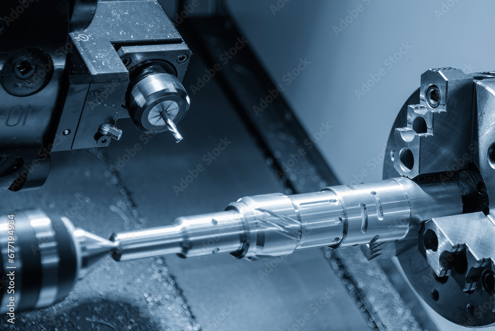 The CNC lathe machine slot milling the brass shaft parts by milling spindle. The CNC lathe machine slot milling the brass shaft parts by milling spindle.