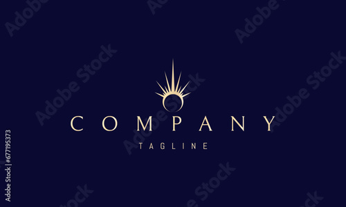 A vector golden logo with an abstract image of a shining ring.