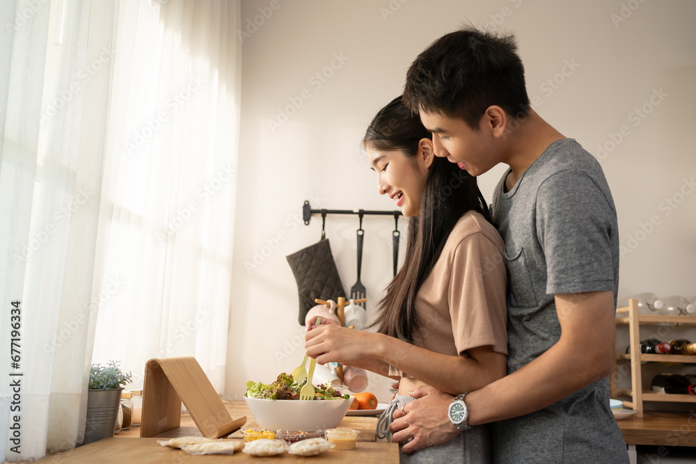 Love, romance and fun Asian couple hugging, cooking in a kitchen and sharing an intimate moment. Romantic boyfriend and girlfriend embracing, enjoying their relationship. Love, romance and fun Asian couple hugging, cooking in a kitchen and sharing an intimate moment. Romantic boyfriend and girlfriend embracing, enjoying their relationship.