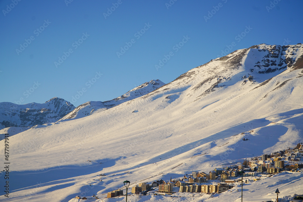 View of a ski resort in the middle of the snowy mountain. 