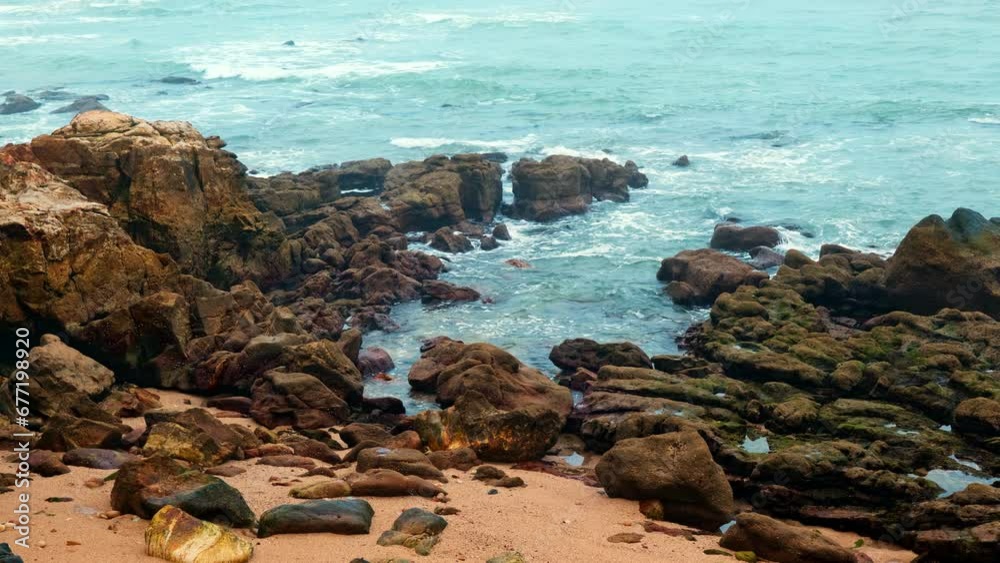 Scenic rocky shore of the Atlantic Ocean between Estoril and Cascais in Lisbon District, Portugal. Scenic rocky shore of the Atlantic Ocean between Estoril and Cascais in Lisbon District, Portugal.