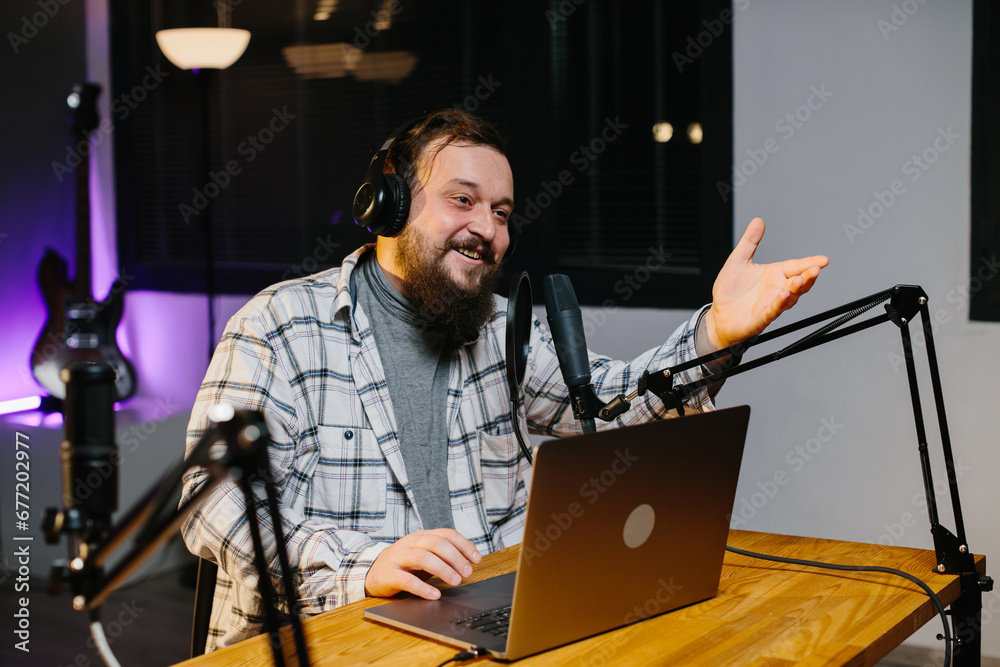 An online blogger speaks into a microphone during a stream. Radio presenter in the studio during the broadcast. An online blogger speaks into a microphone during a stream. Radio presenter in the studio during the broadcast.