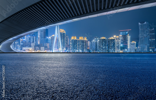Clean asphalt road and city skyline in Chongqing at night