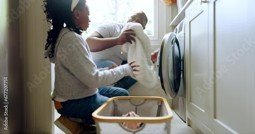 Laundry, washing machine and a father in the home with his girl child for spring cleaning or housework together. Black family, a man and daughter in a washroom for a housekeeping or chores routine photo