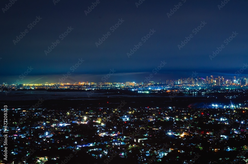 Aerial cityscape with lights from buildings at night