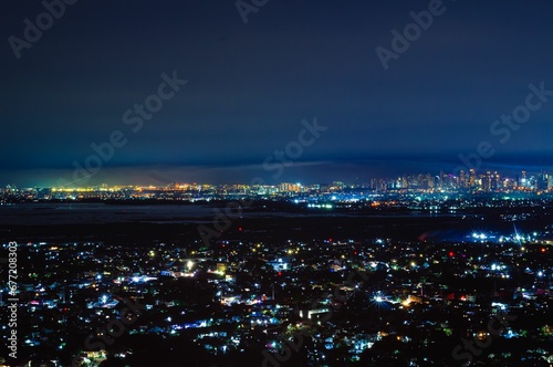 Aerial cityscape with lights from buildings at night