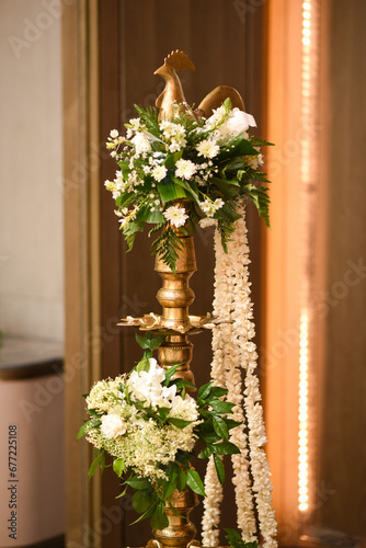 Close up of Wedding oil lamp with floral decorations