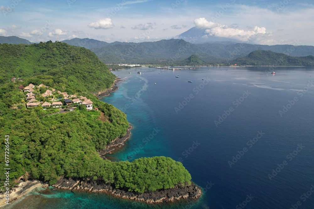 Fototapeta premium Drone view of Manggis Bay and Mount Agung on sunny day. Bali, Indonesia.