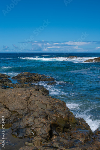 Beautiful landscape with deep blue water. Powerful waves crash against black volcanic rocks on the coast of ´Aguas Verdes, Fuerteventura island. © Aimur