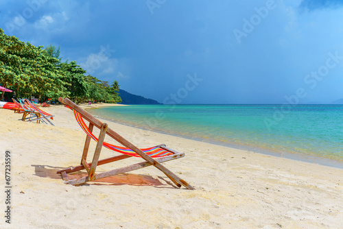 Armchair on the Klong Kloi beach, in Koh Chang island, Trat province, Thailand  © avtk