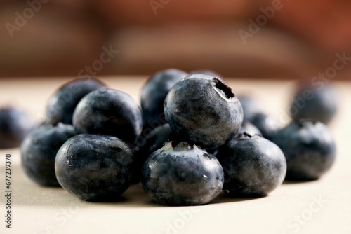 Closeup shot of tasty blueberries placed on a wooden surface