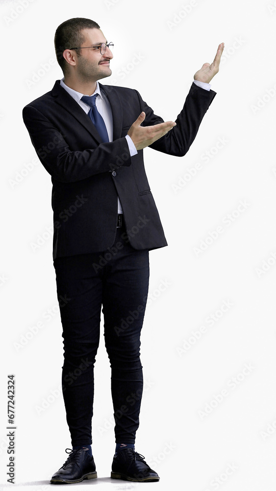 young man in full growth. isolated on white background demonstrates with hands young man in full growth. isolated on white background demonstrates with hands