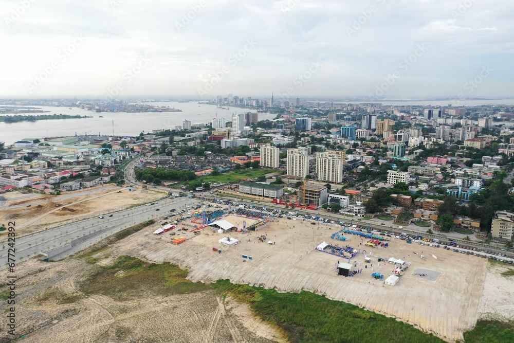Aerial view of Lagos city waterside buildings and roads on a cloudy day