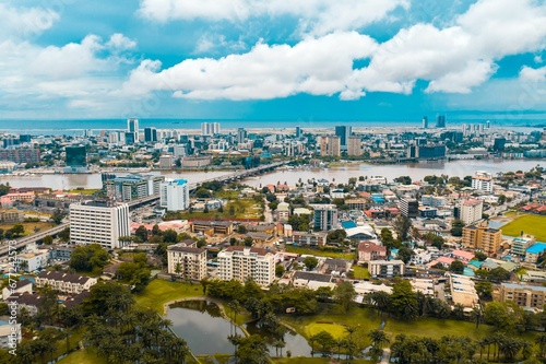 Fototapeta Naklejka Na Ścianę i Meble -  Aerial view of Lagos cityscape before the sea on a sunny day