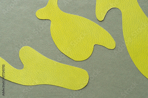 abstract green paper shapes on rough green scrapbooking paper
