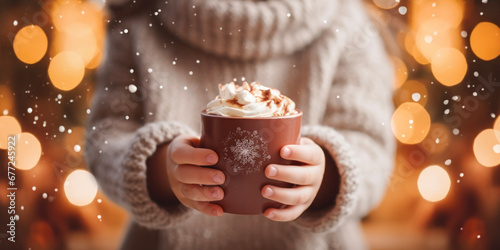 Fireside Comfort: Hands Embrace Hot Chocolate in a Holiday Wonderland.