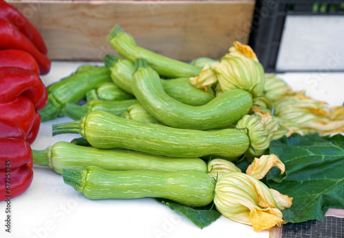 Nice. French market. Fresh zucchini with flowers sold at the market. Zucchini flowers are used in traditional French cuisine