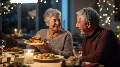 An elderly couple shares a joyful dinner at home  laughing and bonding over candlelit delicacies and wine.