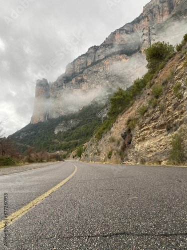 Empty road on the side of a rocky moountain in Andorra photo