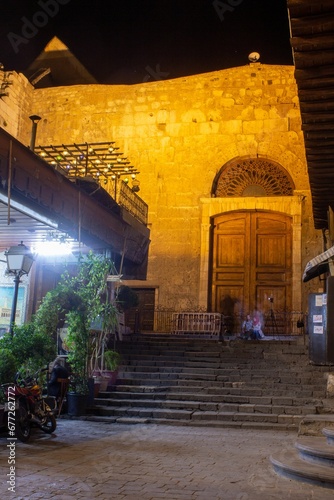 The eastern door of the Great Umayyad Mosque at night in Damascus, Syria photo