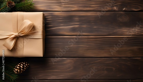 Vista superior de caja de regalo de papel artesanal con temática navideña sobre mesa de madera. Espacio para texto. photo