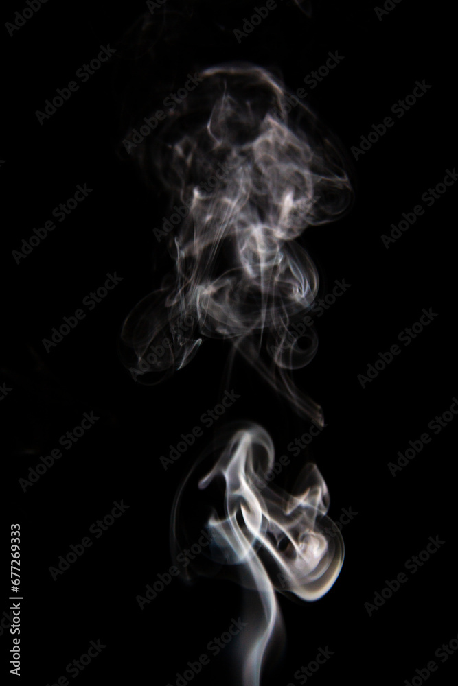 White Smoke Cigarette in Dark Background White Smoke Cigarette in Dark Background
