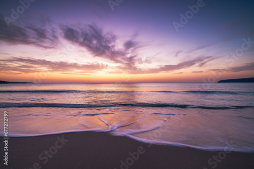 Beautiful cloudscape over the sea wave and beach, seascape at sunrise