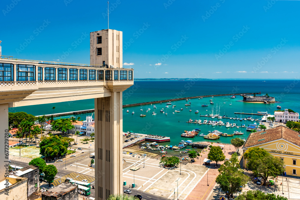 View of Baia de Todos os Santos and Elevador Lacerda on a sunny summer day in the city of Salvador in Bahia - obrazy, fototapety, plakaty 