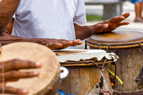 Percussionists playing their instruments during a capoeira performance in a Pelourinho square in the city of Salvador, Bahia